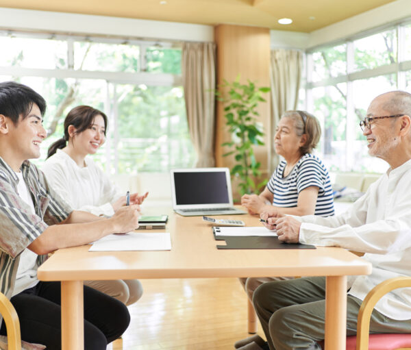 Young couple and old couple talking with a smile